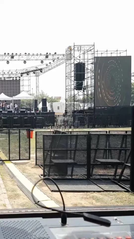 Concert stage, LED screen and barricades being set up on site