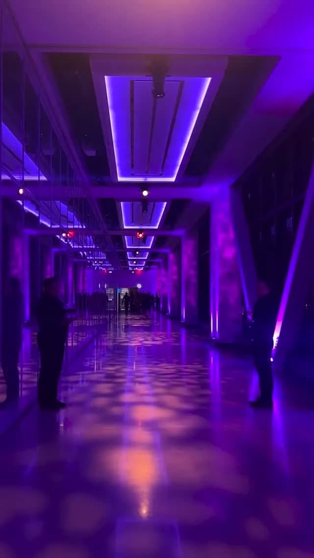 Corporate venue entrance corridor washed in purple light